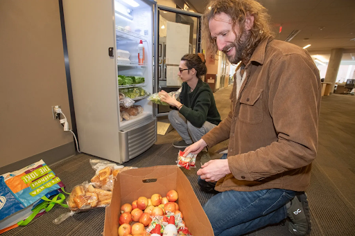 John Jones, Ph.D., and Federal Work-Study students like Jade Underwood make sure that the campus' three Ram Fridges are stocked and monitored for safety.